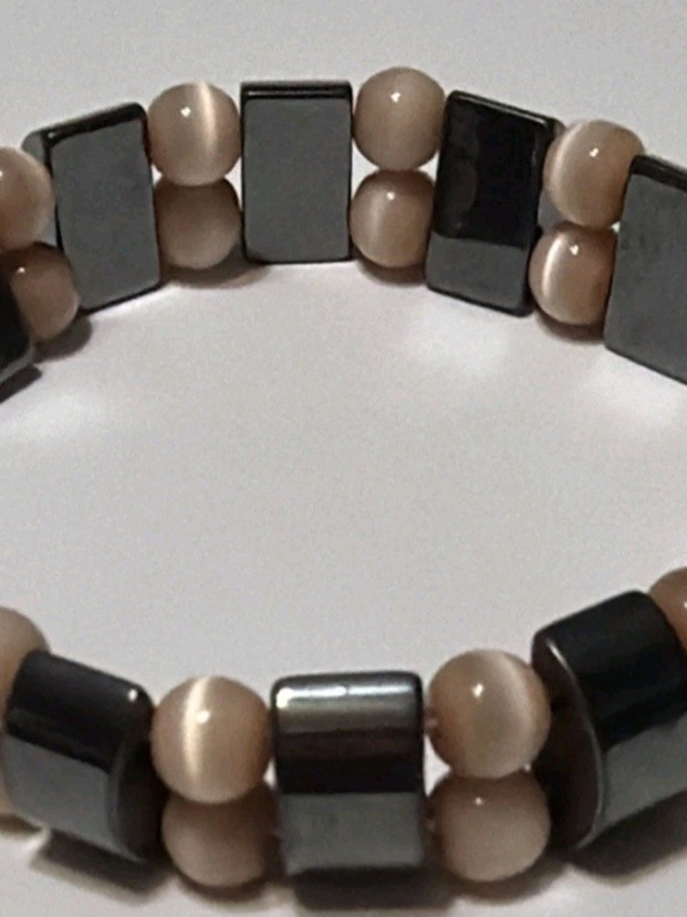 Beige and Hematite Beaded Stretch Bracelet — Polished Two-Tone Design